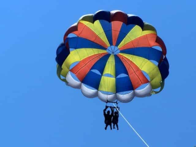 person parasailing over ocean