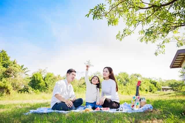 Family enjoying an outdoor picnic