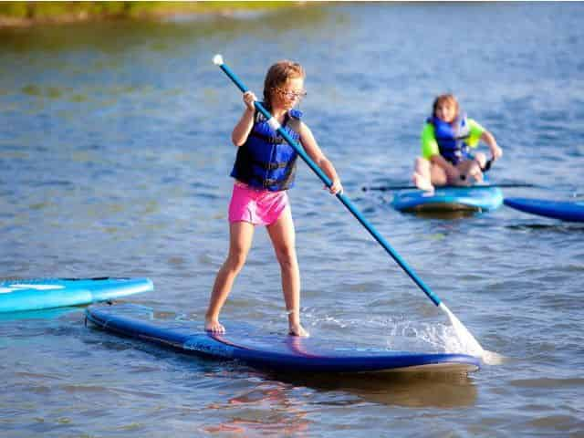 santa rosa beach kids paddleboarding in watersports camp