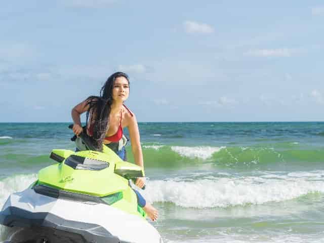 woman riding jet ski crab island destin