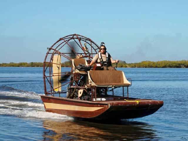 airboat gliding over the swamplands