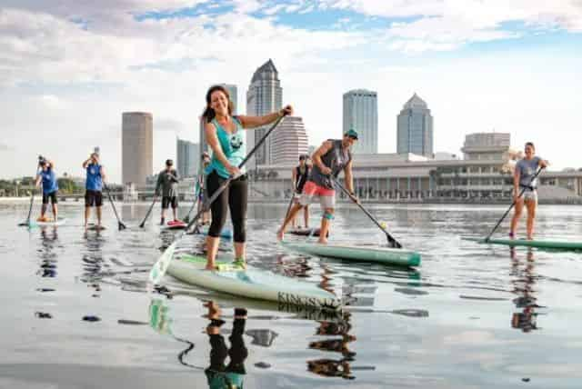 group paddleboarding through downtown tampa