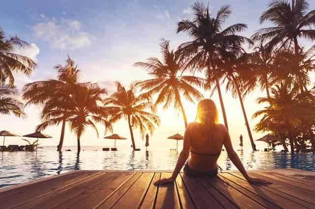 Woman enjoying vacation at beachfront resort