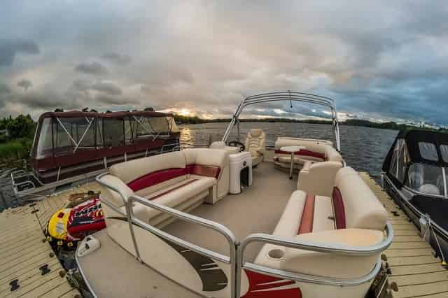 Sunset sky with party pontoon boat