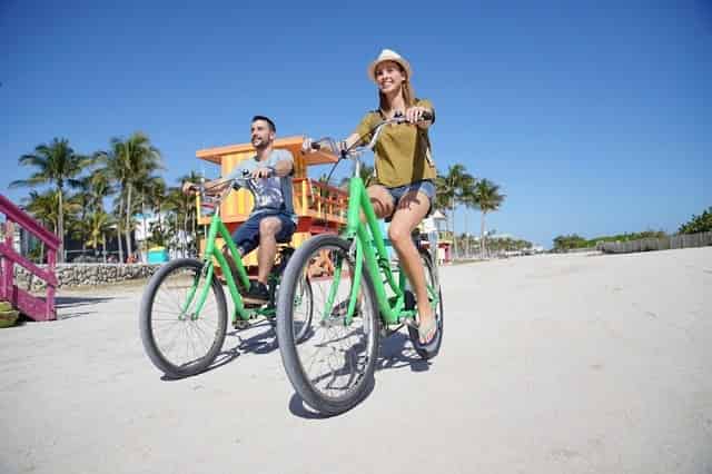 Tourists riding bikes Is Miami the Same as Miami Beach?