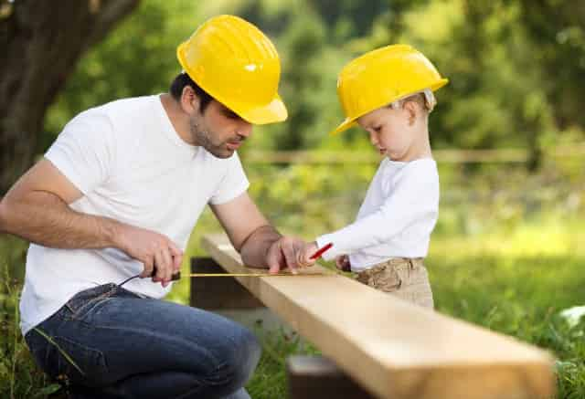 father and son building something together