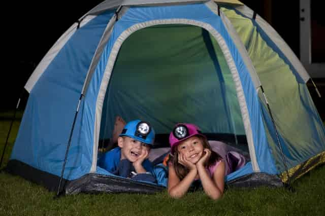 children camping overnight in the backyard