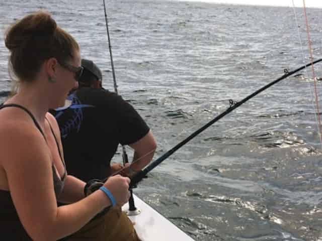 woman offshore fishing with little river fleet