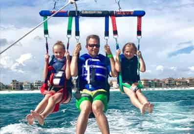 A Dip with the Dolphins Morning Parasailing in Miramar Beach